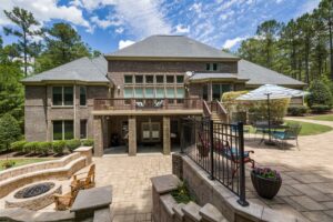 Fire pit patio Richmond VA with paver seating, outdoor living space, stone walls, and landscaped backyard
